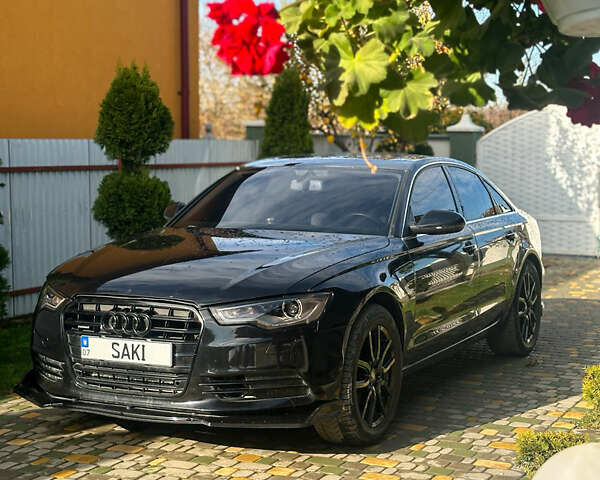 Черный Ауди А6, объемом двигателя 2 л и пробегом 265 тыс. км за 12750 $, фото 1 на Automoto.ua