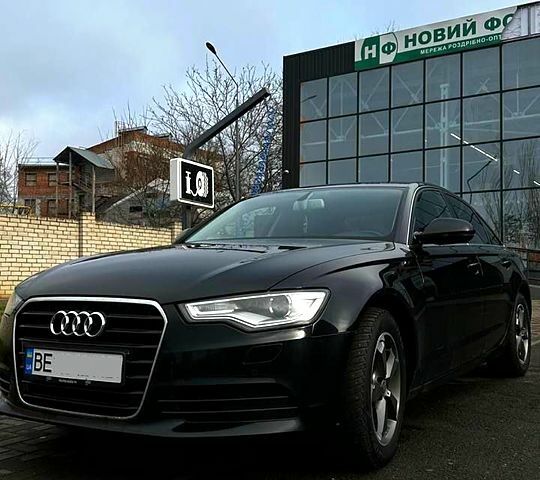 Чорний Ауді А6, об'ємом двигуна 2 л та пробігом 22800 тис. км за 12400 $, фото 1 на Automoto.ua
