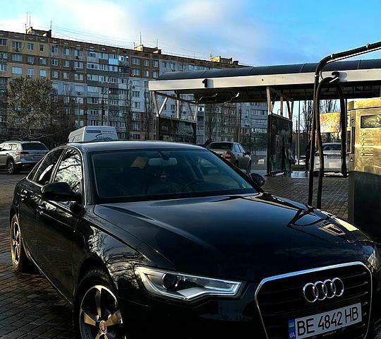 Черный Ауди А6, объемом двигателя 2 л и пробегом 220 тыс. км за 12649 $, фото 1 на Automoto.ua