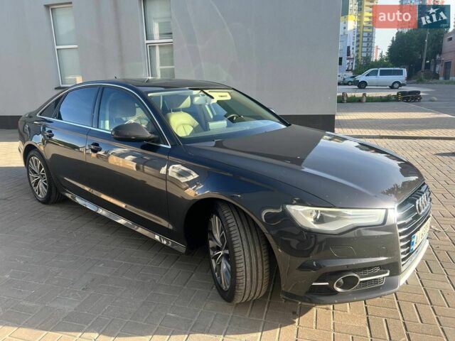 Черный Ауди А6, объемом двигателя 2 л и пробегом 235 тыс. км за 12900 $, фото 1 на Automoto.ua