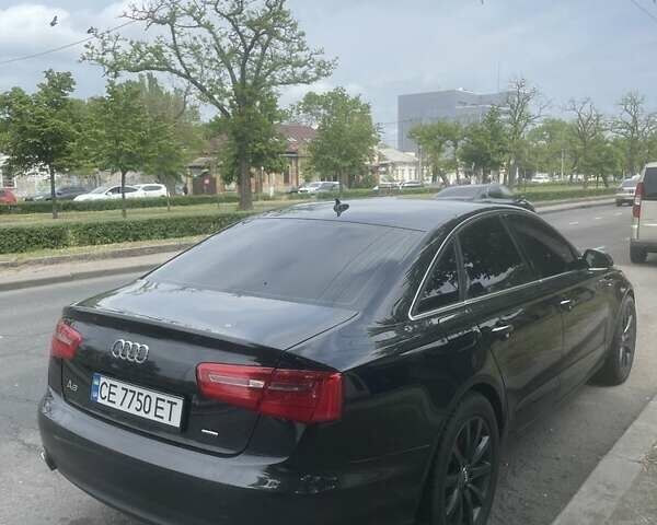 Черный Ауди А6, объемом двигателя 2 л и пробегом 200 тыс. км за 12500 $, фото 1 на Automoto.ua