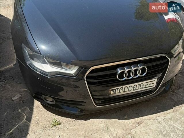 Черный Ауди А6, объемом двигателя 2 л и пробегом 289 тыс. км за 15400 $, фото 1 на Automoto.ua