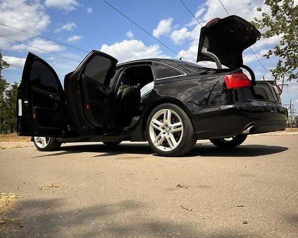 Черный Ауди А6, объемом двигателя 1.98 л и пробегом 278 тыс. км за 13000 $, фото 1 на Automoto.ua