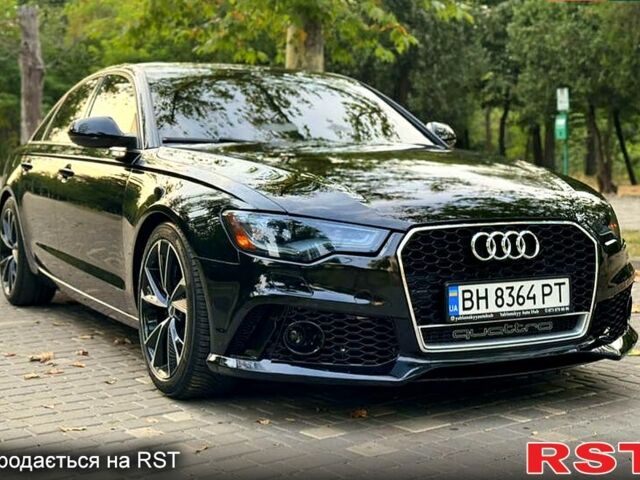 Черный Ауди А6, объемом двигателя 2 л и пробегом 140 тыс. км за 13900 $, фото 1 на Automoto.ua