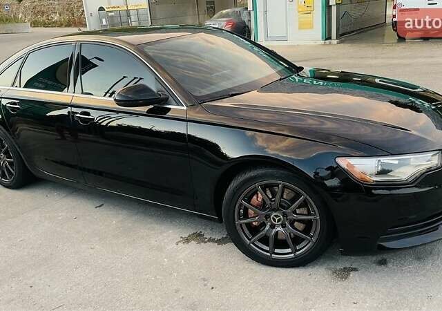 Черный Ауди А6, объемом двигателя 2 л и пробегом 165 тыс. км за 14600 $, фото 1 на Automoto.ua