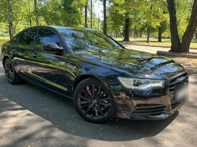 Черный Ауди А6, объемом двигателя 2 л и пробегом 216 тыс. км за 17300 $, фото 1 на Automoto.ua