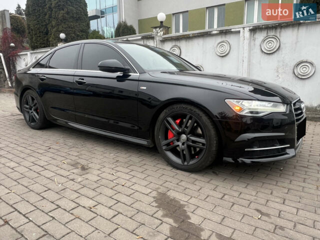Черный Ауди А6, объемом двигателя 2 л и пробегом 165 тыс. км за 18800 $, фото 1 на Automoto.ua