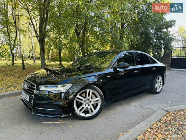 Черный Ауди А6, объемом двигателя 2 л и пробегом 72 тыс. км за 19900 $, фото 1 на Automoto.ua