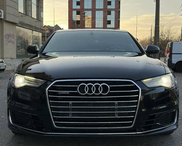 Черный Ауди А6, объемом двигателя 2 л и пробегом 250 тыс. км за 17500 $, фото 1 на Automoto.ua