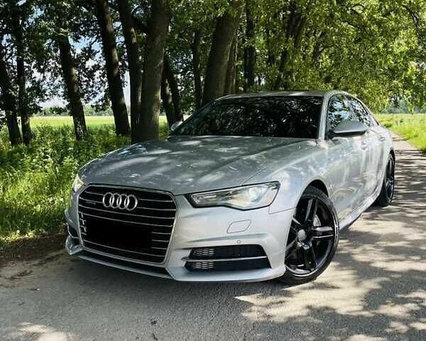 Чорний Ауді А6, об'ємом двигуна 2 л та пробігом 134 тис. км за 13888 $, фото 1 на Automoto.ua