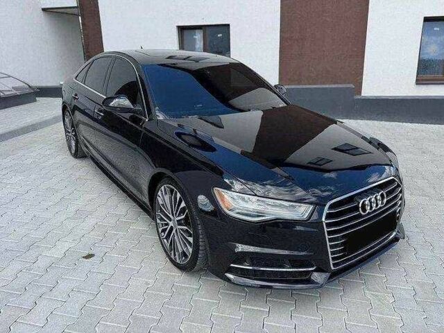 Черный Ауди А6, объемом двигателя 2 л и пробегом 170 тыс. км за 13514 $, фото 1 на Automoto.ua