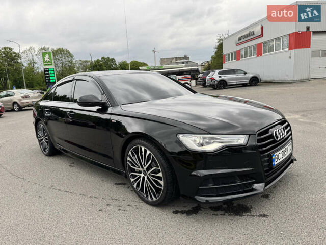 Черный Ауди А6, объемом двигателя 2 л и пробегом 174 тыс. км за 19700 $, фото 1 на Automoto.ua