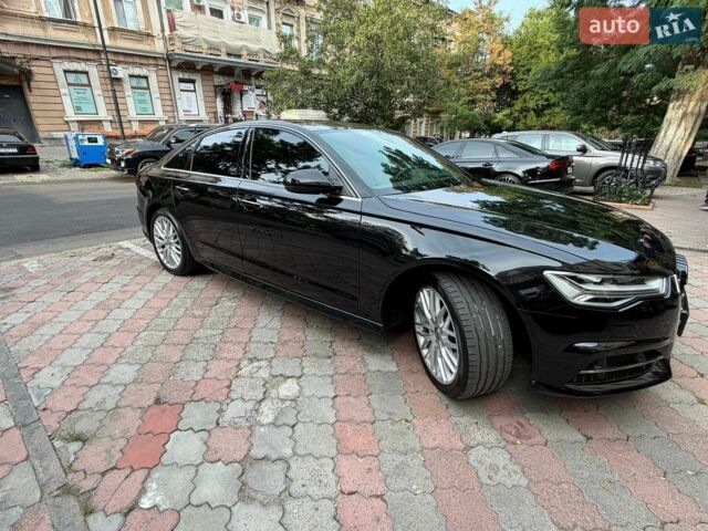 Черный Ауди А6, объемом двигателя 2 л и пробегом 153 тыс. км за 23500 $, фото 1 на Automoto.ua