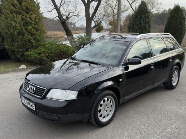 Черный Ауди А6, объемом двигателя 1.8 л и пробегом 300 тыс. км за 1750 $, фото 1 на Automoto.ua