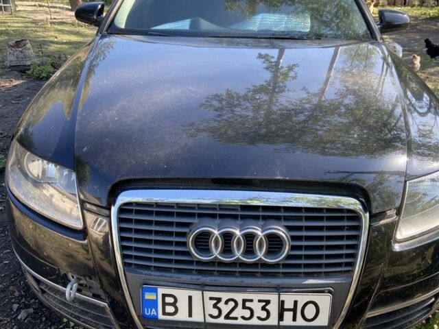 Черный Ауди А6, объемом двигателя 2 л и пробегом 300 тыс. км за 6000 $, фото 1 на Automoto.ua
