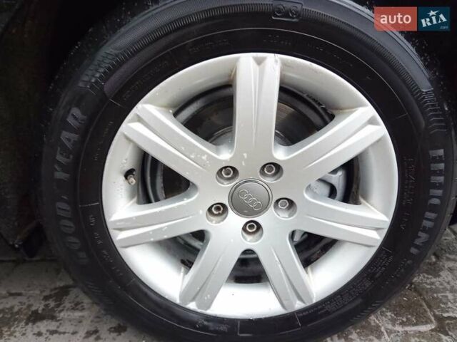 Черный Ауди А6, объемом двигателя 2 л и пробегом 265 тыс. км за 12500 $, фото 1 на Automoto.ua