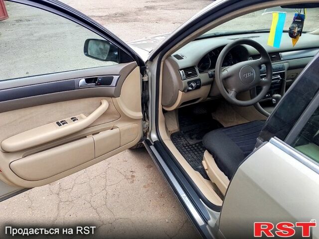 Серый Ауди А6, объемом двигателя 2.5 л и пробегом 325 тыс. км за 4000 $, фото 1 на Automoto.ua