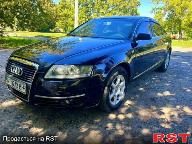 Синий Ауди А6, объемом двигателя 2.4 л и пробегом 317 тыс. км за 6900 $, фото 1 на Automoto.ua