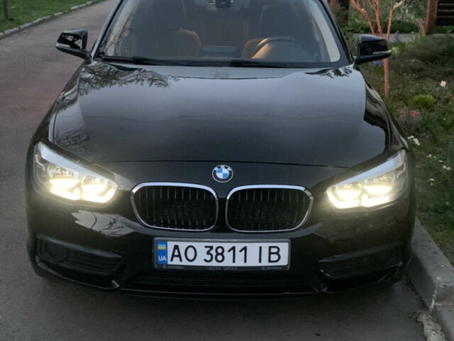 Черный БМВ 1 Серия, объемом двигателя 1.5 л и пробегом 170 тыс. км за 10000 $, фото 1 на Automoto.ua