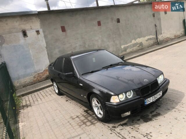 Черный БМВ 3 Серия, объемом двигателя 1.6 л и пробегом 491 тыс. км за 2700 $, фото 1 на Automoto.ua