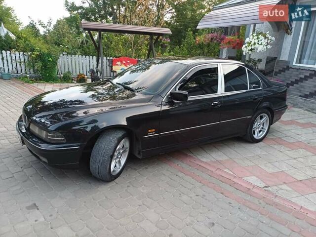Черный БМВ 5 Серия, объемом двигателя 2.5 л и пробегом 340 тыс. км за 4600 $, фото 1 на Automoto.ua