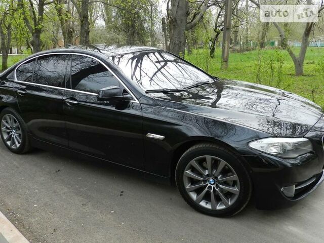 Чорний БМВ 520, об'ємом двигуна 2 л та пробігом 143 тис. км за 27600 $, фото 1 на Automoto.ua