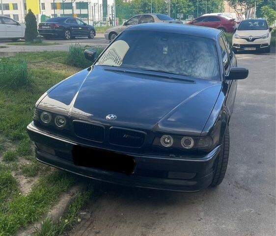 Черный БМВ 7 Серия, объемом двигателя 4.4 л и пробегом 450 тыс. км за 6500 $, фото 1 на Automoto.ua