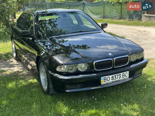 Черный БМВ 7 Серия, объемом двигателя 4.4 л и пробегом 130 тыс. км за 10000 $, фото 1 на Automoto.ua