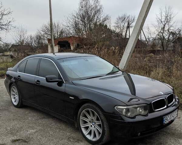 Черный БМВ 7 Серия, объемом двигателя 4.4 л и пробегом 350 тыс. км за 5000 $, фото 1 на Automoto.ua