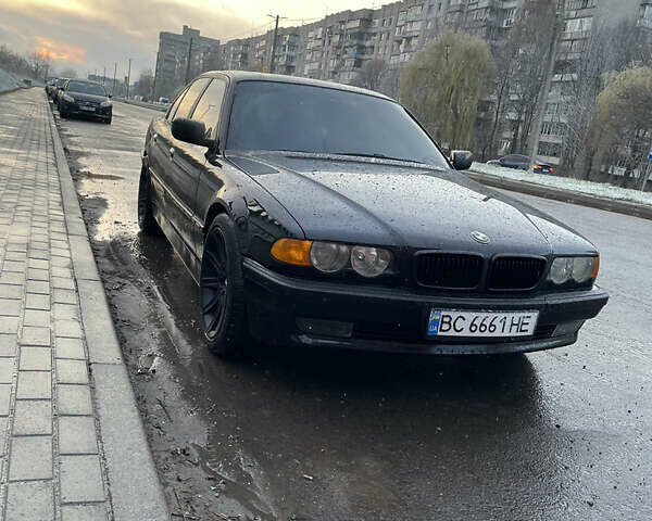 Черный БМВ 7 Серия, объемом двигателя 4.4 л и пробегом 380 тыс. км за 5000 $, фото 1 на Automoto.ua