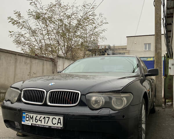 Черный БМВ 7 Серия, объемом двигателя 4.4 л и пробегом 400 тыс. км за 3600 $, фото 1 на Automoto.ua