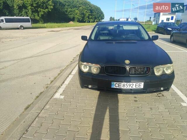 Черный БМВ 7 Серия, объемом двигателя 2.99 л и пробегом 372 тыс. км за 8000 $, фото 1 на Automoto.ua