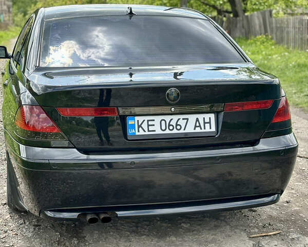 Черный БМВ 7 Серия, объемом двигателя 4.4 л и пробегом 300 тыс. км за 4500 $, фото 1 на Automoto.ua