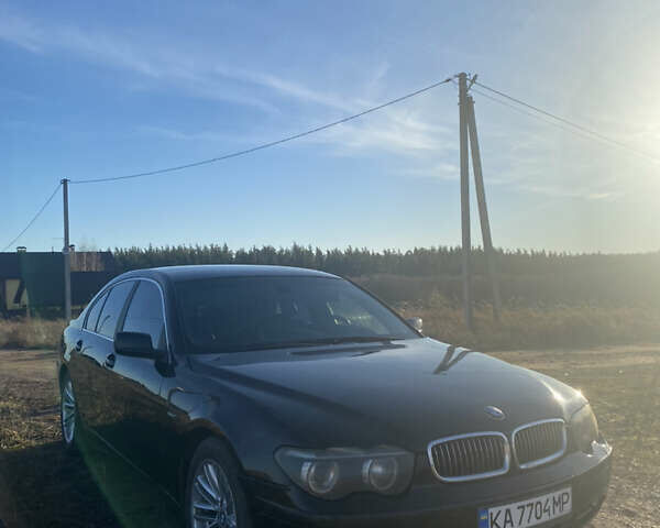 Черный БМВ 7 Серия, объемом двигателя 3.6 л и пробегом 287 тыс. км за 6200 $, фото 1 на Automoto.ua