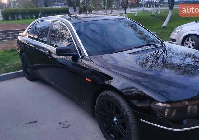 Черный БМВ 7 Серия, объемом двигателя 4.4 л и пробегом 430 тыс. км за 5600 $, фото 1 на Automoto.ua