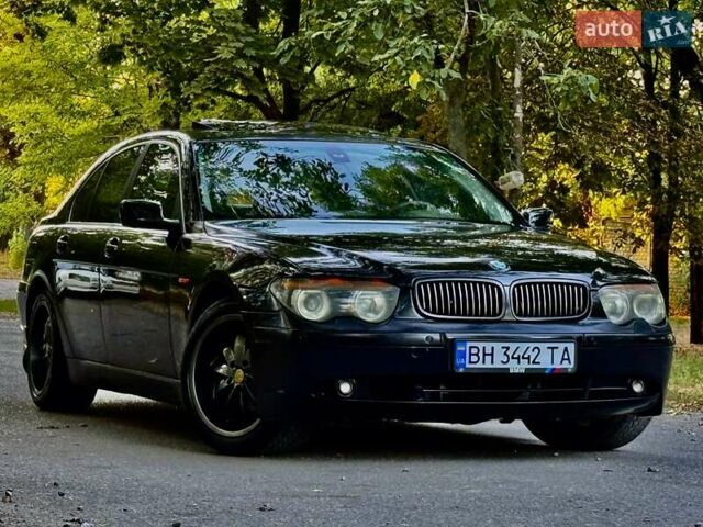 Черный БМВ 7 Серия, объемом двигателя 4.4 л и пробегом 277 тыс. км за 5600 $, фото 1 на Automoto.ua
