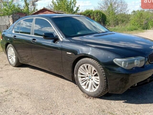 Черный БМВ 7 Серия, объемом двигателя 4.4 л и пробегом 308 тыс. км за 6400 $, фото 1 на Automoto.ua