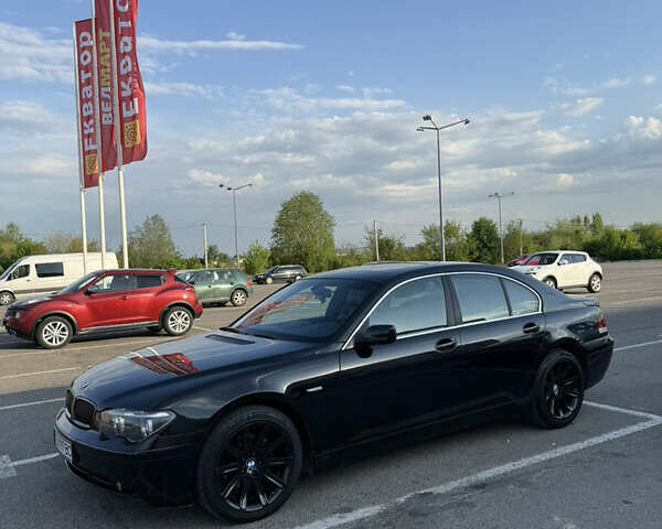 Черный БМВ 7 Серия, объемом двигателя 3 л и пробегом 302 тыс. км за 9500 $, фото 1 на Automoto.ua