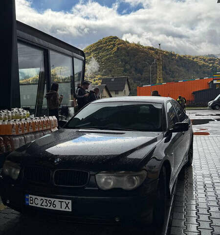 Черный БМВ 7 Серия, объемом двигателя 4.4 л и пробегом 325 тыс. км за 6700 $, фото 1 на Automoto.ua