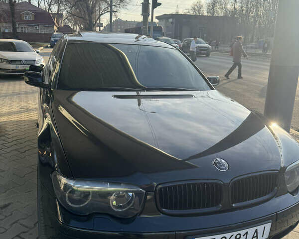 Чорний БМВ 7 Серія, об'ємом двигуна 4.4 л та пробігом 120 тис. км за 6000 $, фото 1 на Automoto.ua
