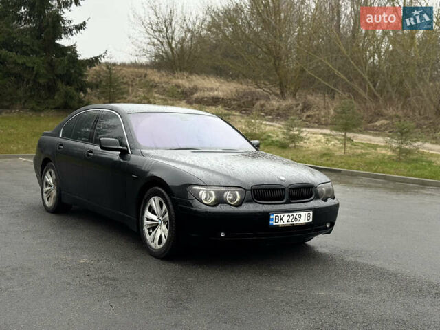 Черный БМВ 7 Серия, объемом двигателя 4 л и пробегом 280 тыс. км за 6500 $, фото 1 на Automoto.ua