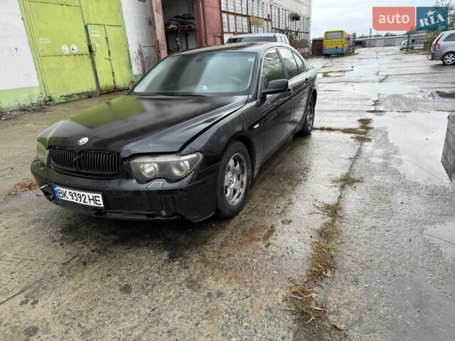 Черный БМВ 7 Серия, объемом двигателя 3.6 л и пробегом 242 тыс. км за 2999 $, фото 1 на Automoto.ua
