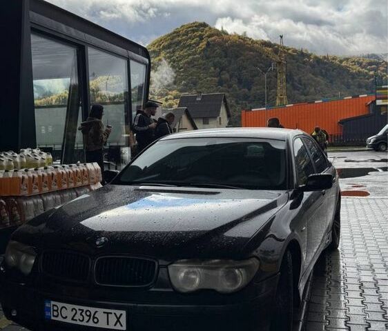 Черный БМВ 7 Серия, объемом двигателя 4.4 л и пробегом 326 тыс. км за 7000 $, фото 1 на Automoto.ua