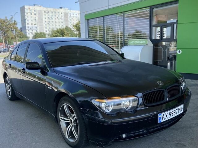 Чорний БМВ 7 Серія, об'ємом двигуна 3 л та пробігом 250 тис. км за 3006 $, фото 1 на Automoto.ua