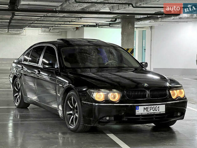 Чорний БМВ 7 Серія, об'ємом двигуна 3 л та пробігом 300 тис. км за 5600 $, фото 1 на Automoto.ua