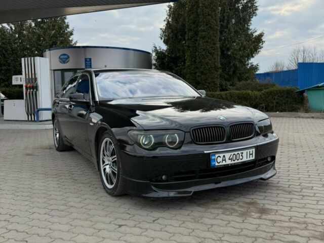 Черный БМВ 7 Серия, объемом двигателя 4.4 л и пробегом 350 тыс. км за 6500 $, фото 1 на Automoto.ua