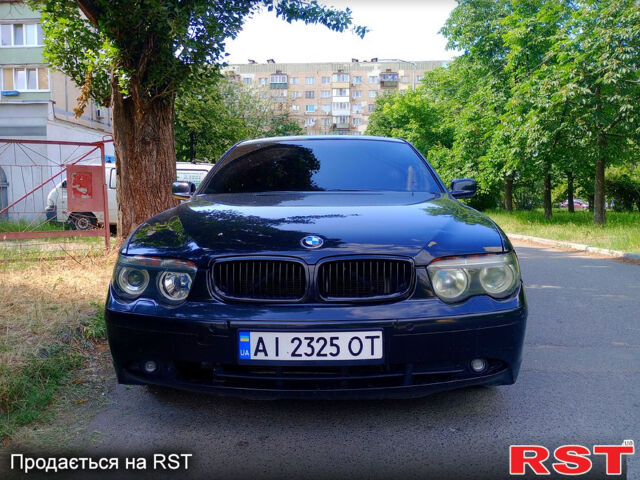 Черный БМВ 7 Серия, объемом двигателя 4.4 л и пробегом 380 тыс. км за 7600 $, фото 1 на Automoto.ua