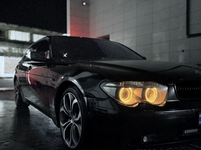 Черный БМВ 7 Серия, объемом двигателя 3.9 л и пробегом 293 тыс. км за 8000 $, фото 1 на Automoto.ua