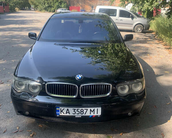 Черный БМВ 7 Серия, объемом двигателя 4.4 л и пробегом 320 тыс. км за 6500 $, фото 1 на Automoto.ua