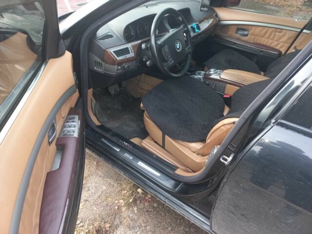 Черный БМВ 7 Серия, объемом двигателя 3 л и пробегом 420 тыс. км за 7000 $, фото 1 на Automoto.ua